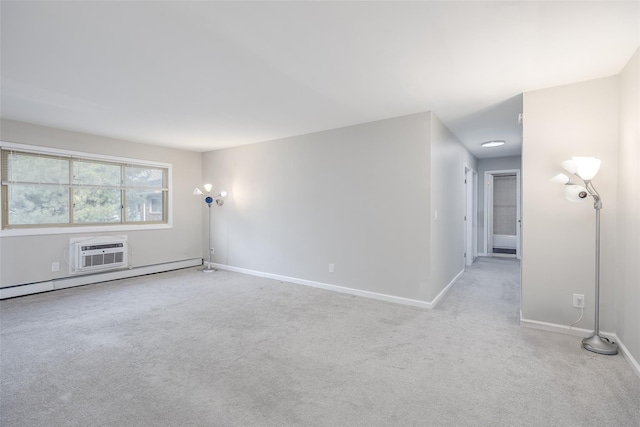 carpeted empty room with a wall unit AC and baseboard heating