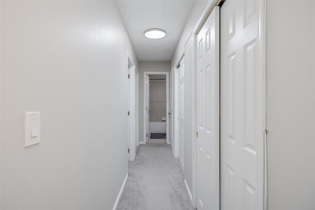 hallway with light carpet