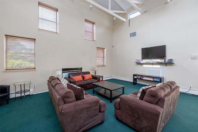 living room with carpet, plenty of natural light, and beamed ceiling