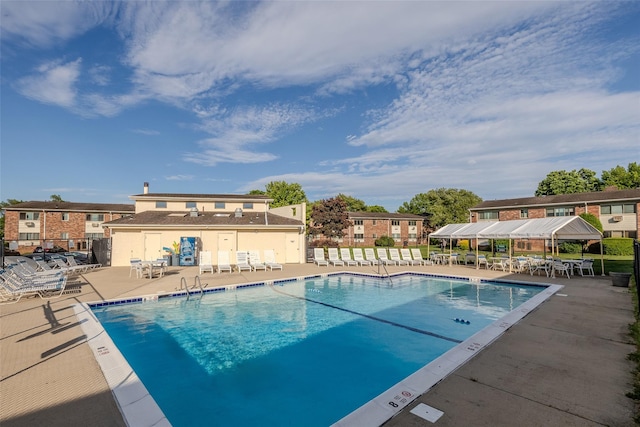 view of swimming pool featuring a patio area