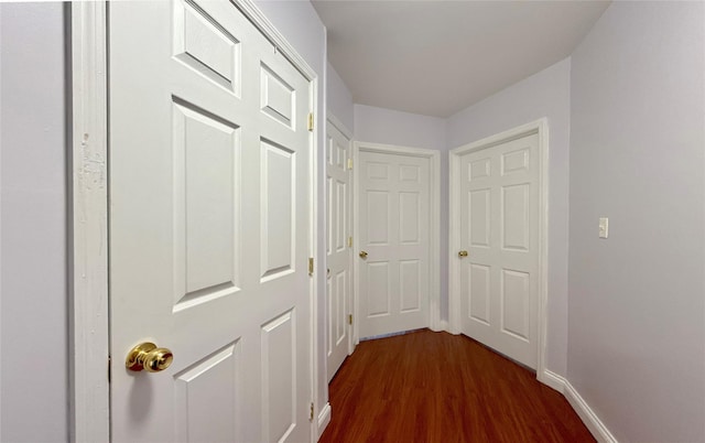 hallway featuring dark hardwood / wood-style floors