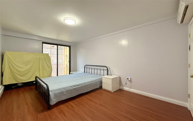 bedroom featuring wood-type flooring and ornamental molding