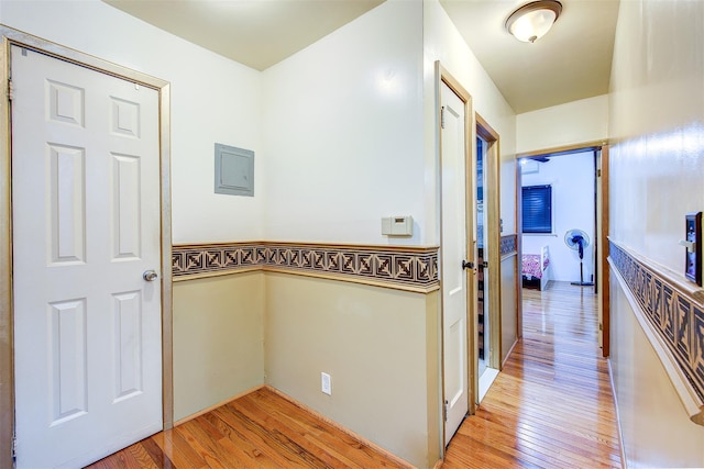 hallway with light hardwood / wood-style flooring