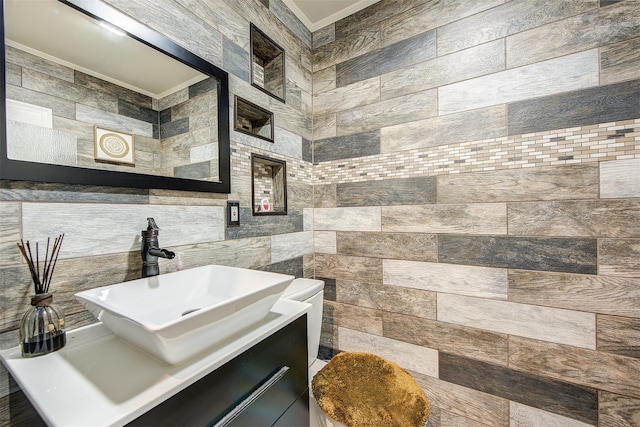 bathroom featuring vanity, tile walls, and ornamental molding