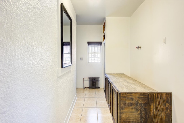 hallway featuring light tile patterned floors