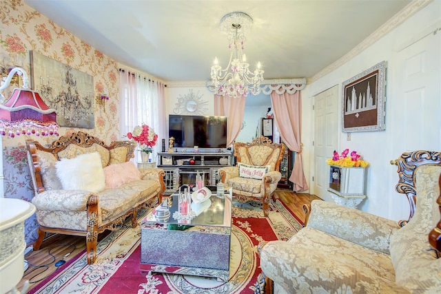 living room with a chandelier, wood-type flooring, and ornamental molding