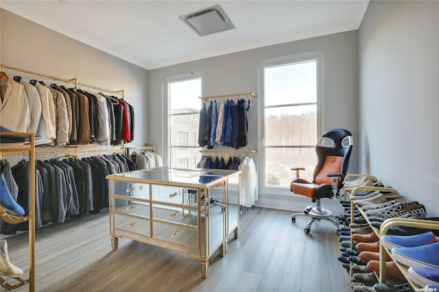 spacious closet featuring hardwood / wood-style floors