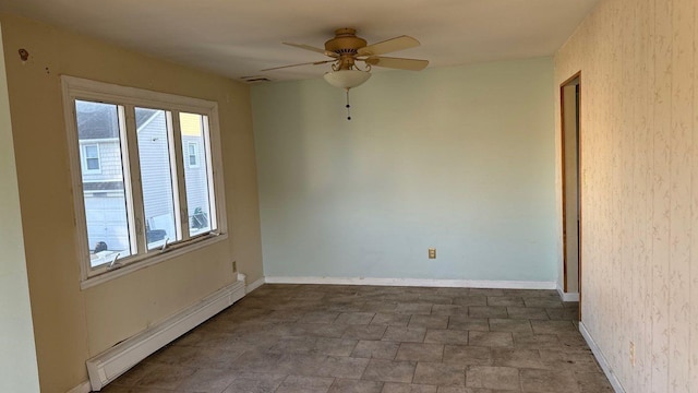 empty room with baseboard heating and ceiling fan