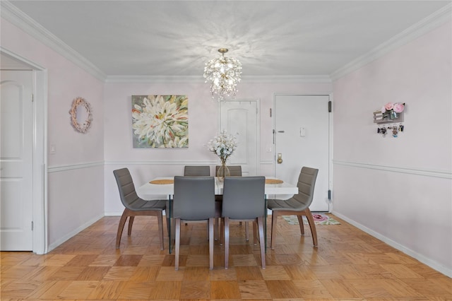 dining space featuring a notable chandelier, crown molding, and light parquet flooring