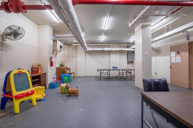 recreation room featuring concrete floors