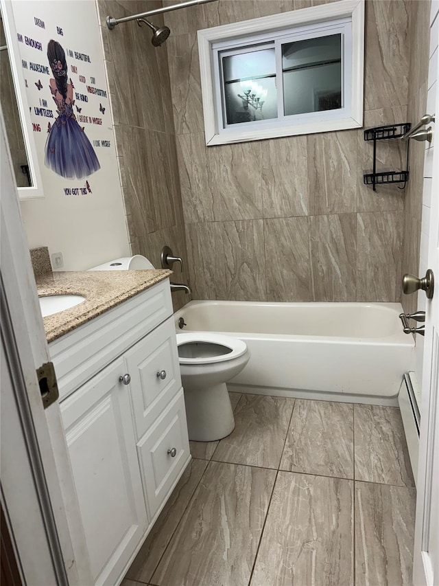 full bathroom featuring vanity, toilet, and tiled shower / bath combo