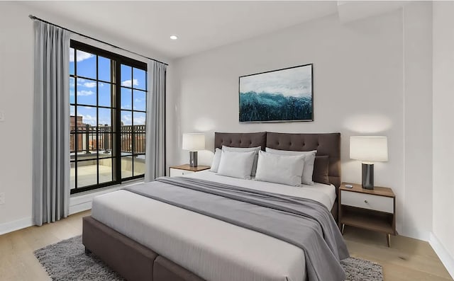 bedroom with light hardwood / wood-style floors