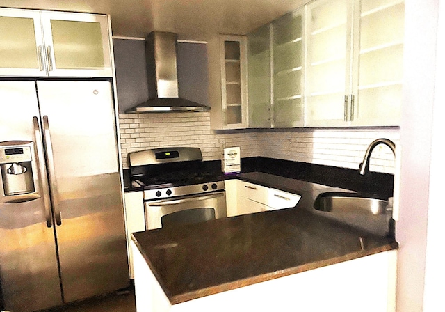 kitchen featuring sink, stainless steel appliances, decorative backsplash, white cabinets, and exhaust hood