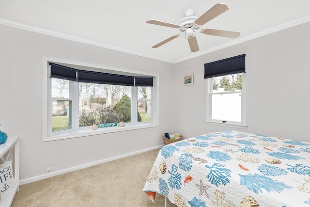 bedroom with ceiling fan, crown molding, and light carpet