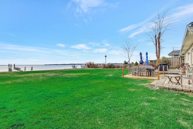 view of yard featuring a patio area and a water view