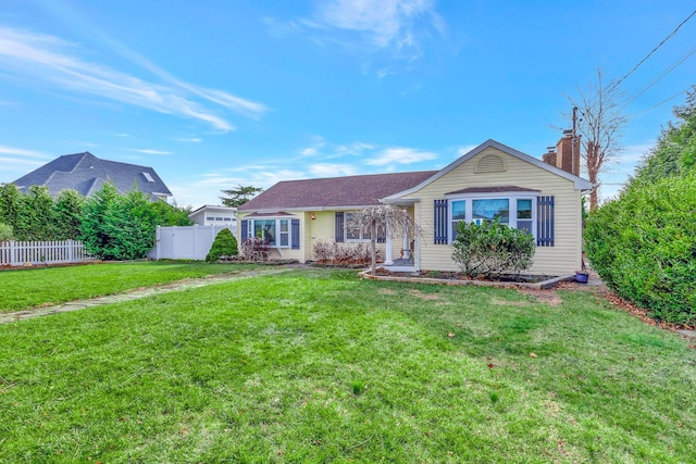 ranch-style home with a front lawn