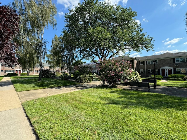 surrounding community featuring a lawn