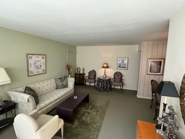 living room with dark colored carpet