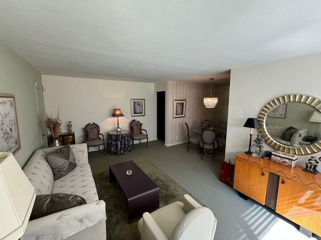 carpeted living room with a chandelier