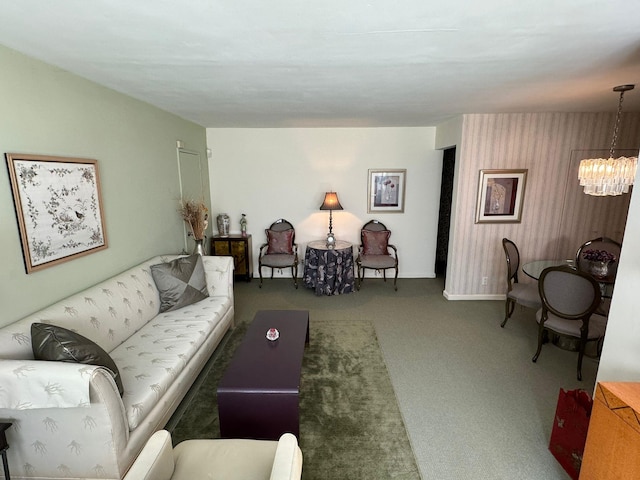 living room featuring a notable chandelier and carpet floors