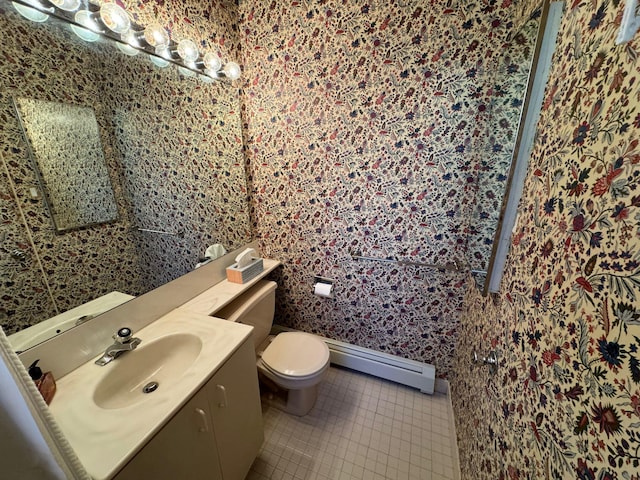 bathroom with tile patterned flooring, vanity, a baseboard radiator, and toilet