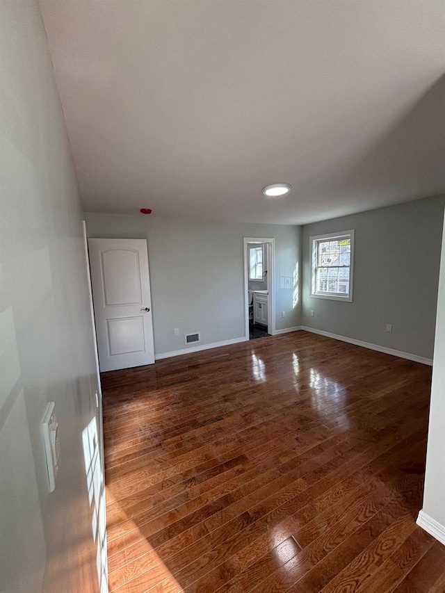 empty room featuring dark wood-type flooring