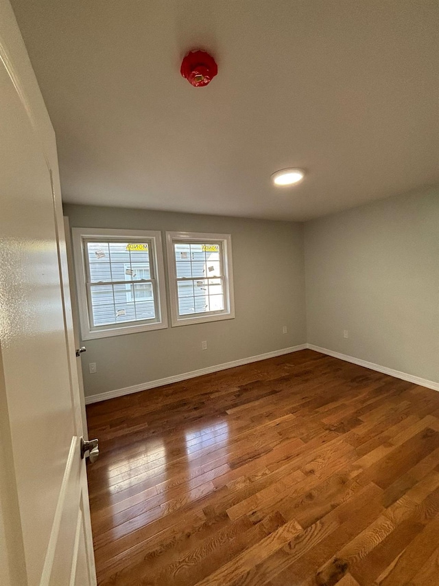 spare room featuring dark hardwood / wood-style floors