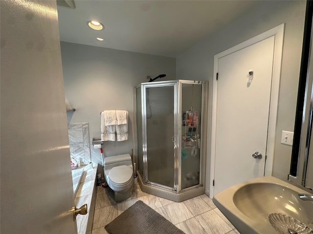 full bath with toilet, recessed lighting, and a stall shower