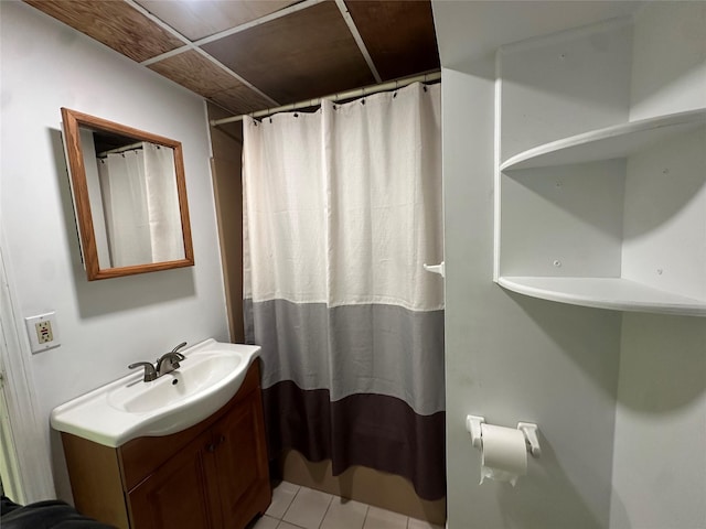 full bathroom featuring vanity, tile patterned floors, and curtained shower