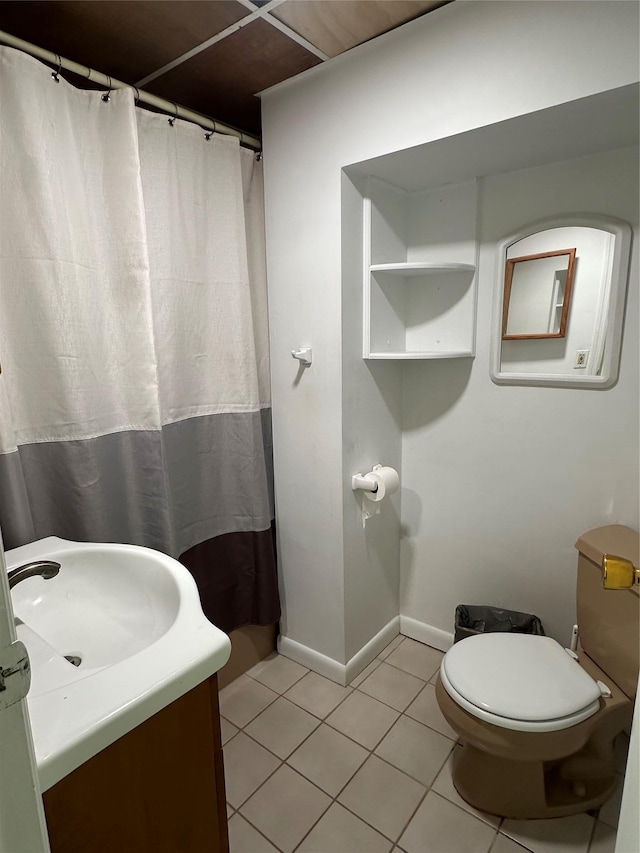 bathroom featuring tile patterned flooring, baseboards, toilet, a shower with curtain, and vanity