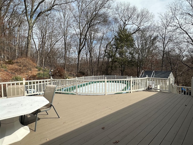 deck with a fenced in pool