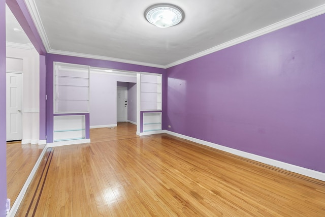 interior space featuring light wood-type flooring and crown molding