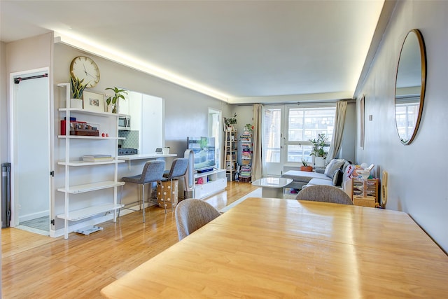 dining area featuring light wood-type flooring