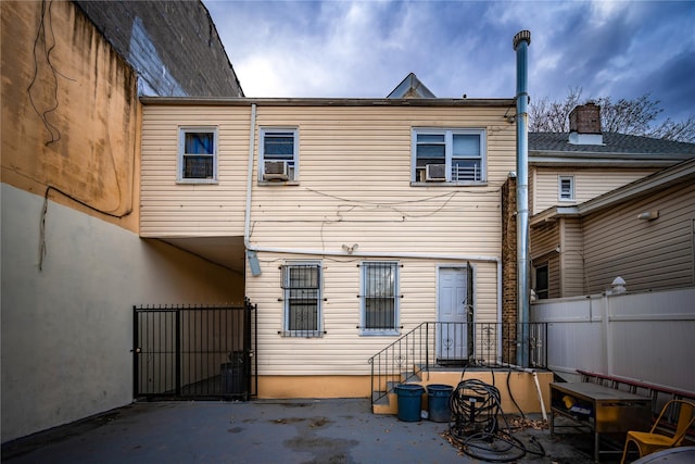 back of property with cooling unit