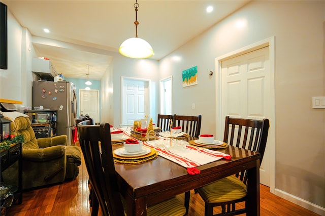 dining room with dark hardwood / wood-style floors