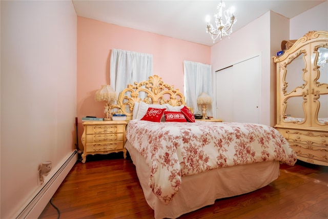 bedroom featuring a chandelier, dark hardwood / wood-style flooring, and a baseboard radiator