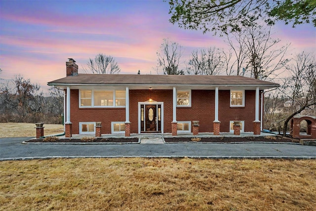 bi-level home featuring a yard