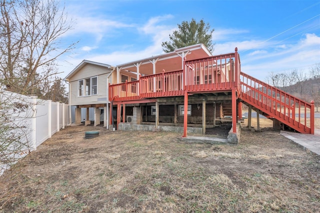 back of property with a wooden deck