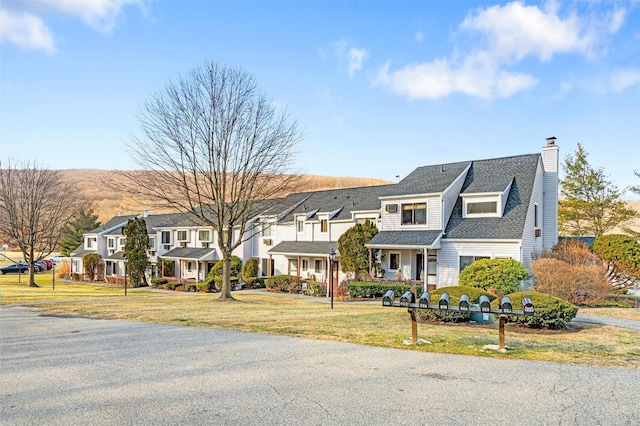 view of front of home with a front lawn