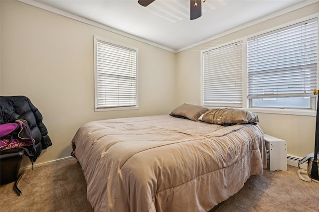 carpeted bedroom featuring ceiling fan and ornamental molding