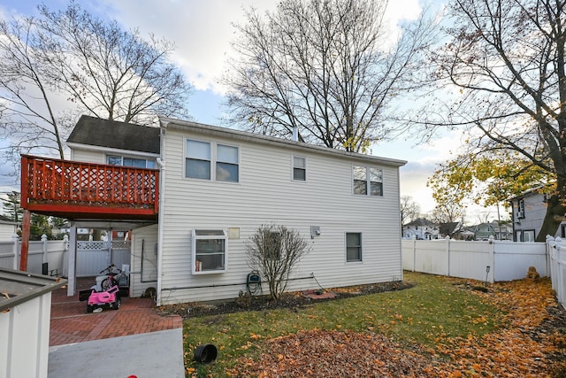 rear view of property with a yard