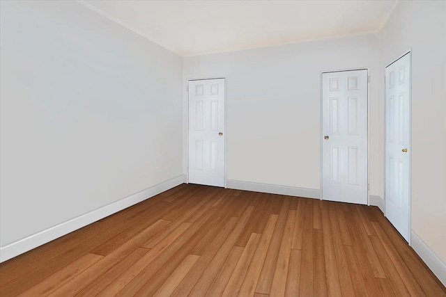 empty room with wood-type flooring