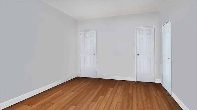 spare room featuring hardwood / wood-style floors