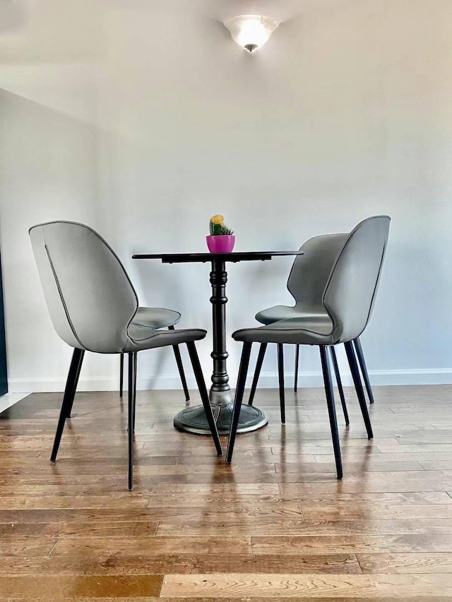 dining space with light hardwood / wood-style flooring