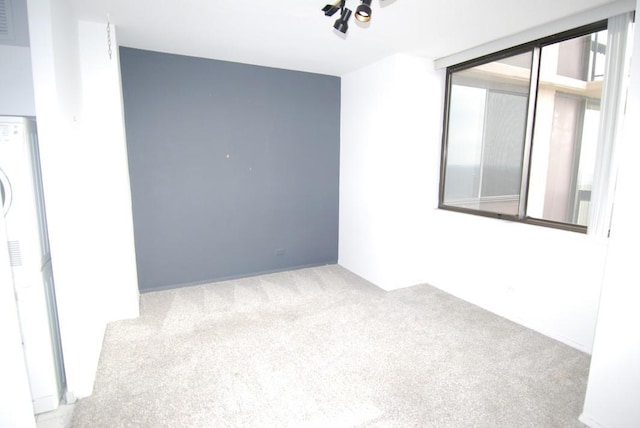 empty room with light colored carpet