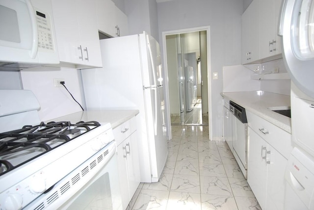 kitchen with white cabinets and white appliances