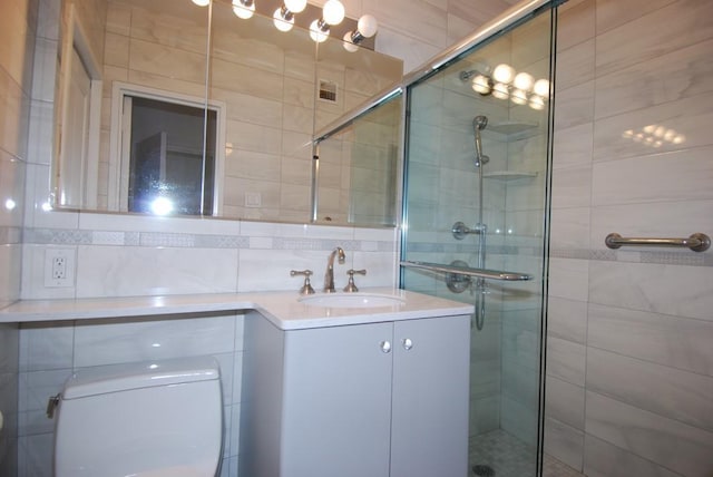 bathroom featuring vanity, toilet, and walk in shower