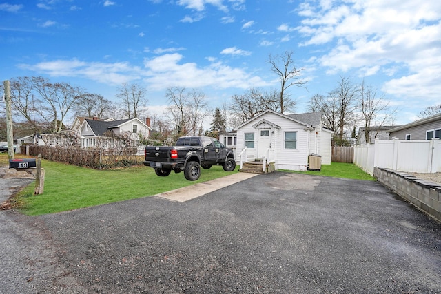 view of side of home featuring a lawn