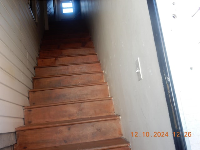 stairway with wooden walls