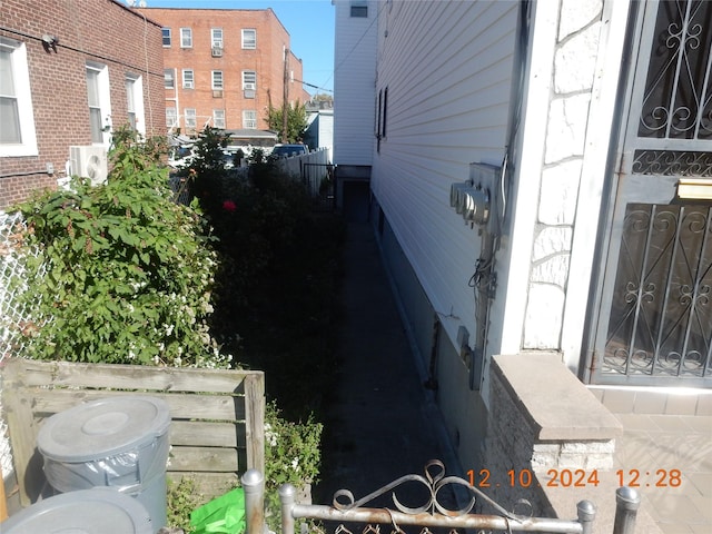 view of side of home featuring ac unit